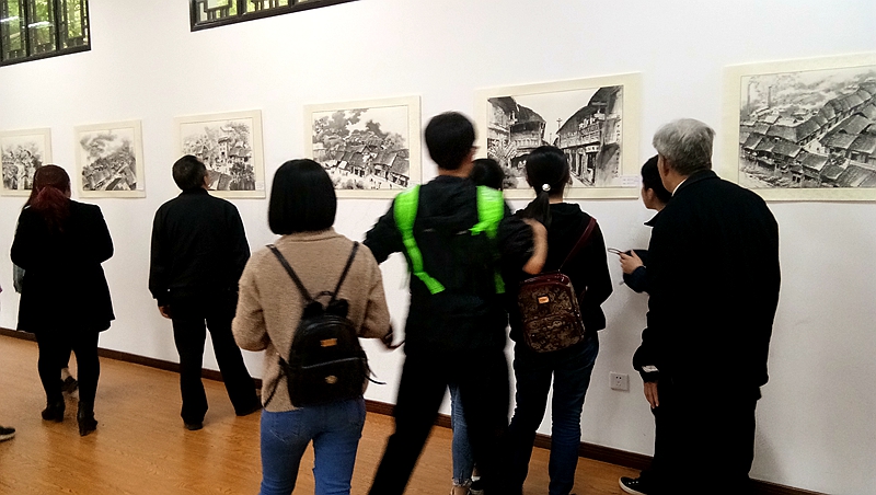 张重渝 周兴龙 《记忆南充》民俗画展 吸引了